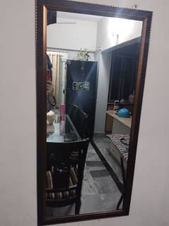 long hanging mirror with wooden frame