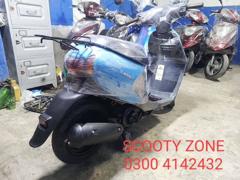 Electric scooty#49cc scooties available contact#0300 4142432# 8