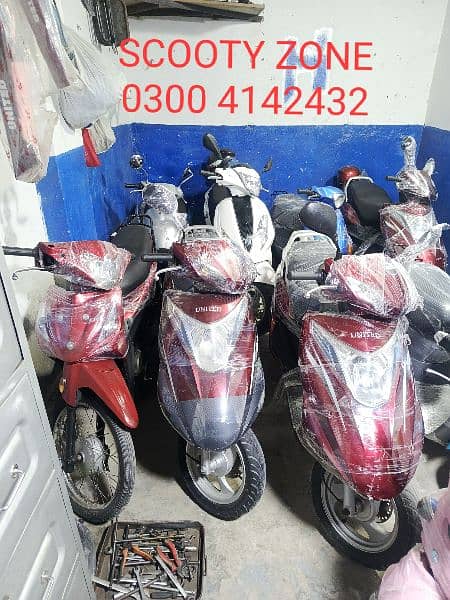 Electric scooty#49cc scooties available contact#0300 4142432# 9