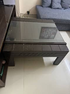 wooden center table with glass top