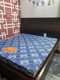 Bed along mattress and site table