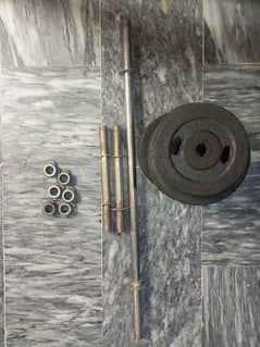 8 rubber  Dumbbell plates and barbell rod (slightly used)