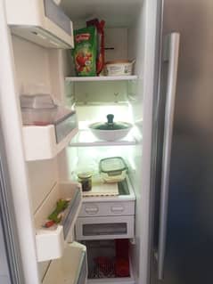 haier side by side refrigerator. in good and working condition