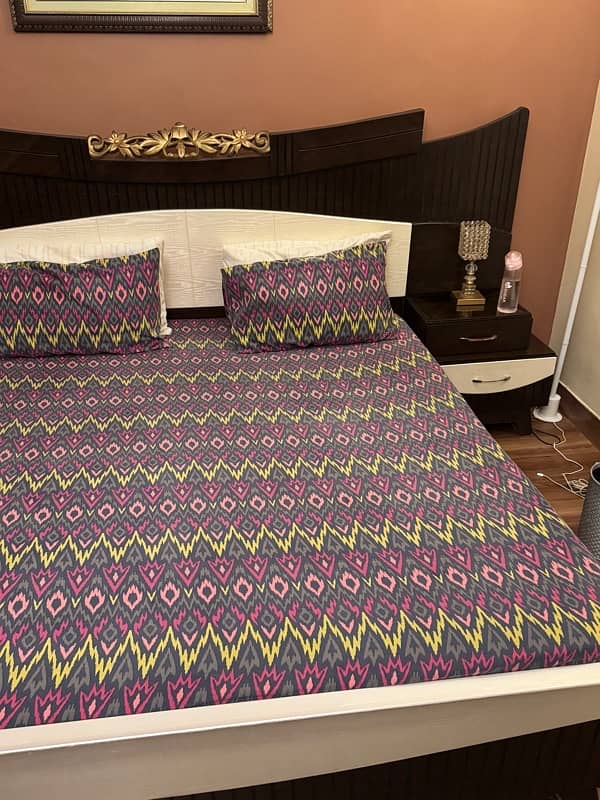 beautiful king size bed with side table and dressing 2