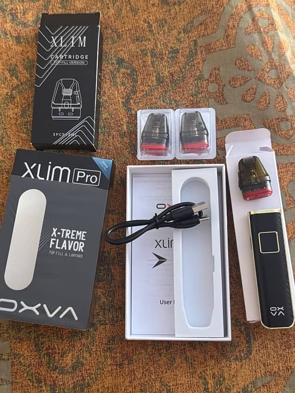 oxva xlim pro with 2  ( 0.4) unused coils 2