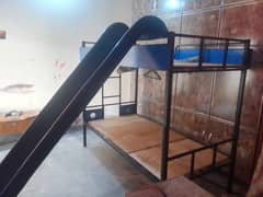 Bunker bed with fiber slide