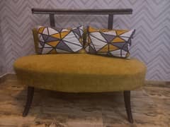 Oval shape two seater beautiful sofa.