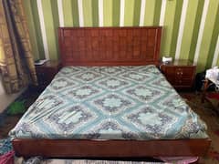 double bed with side tables and dressing table