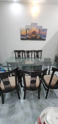 wooden dinning table with glass top