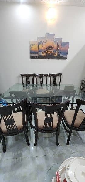 wooden dinning table with glass top 0