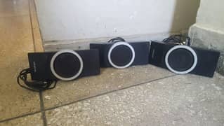 three Creative speakers for use with woofer