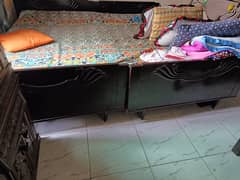 2 single wooden beds are for sale