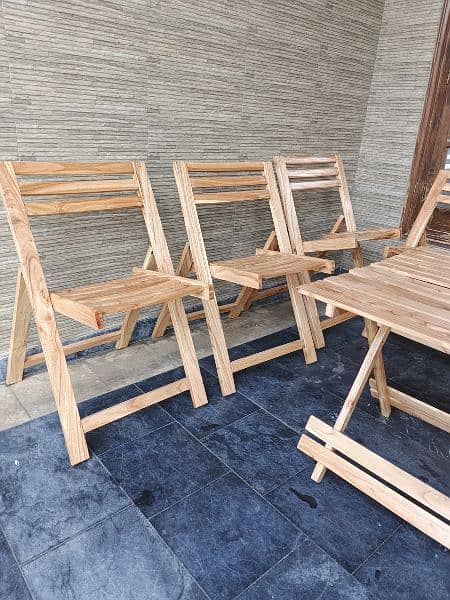 Six foldable wooden chairs with table 1