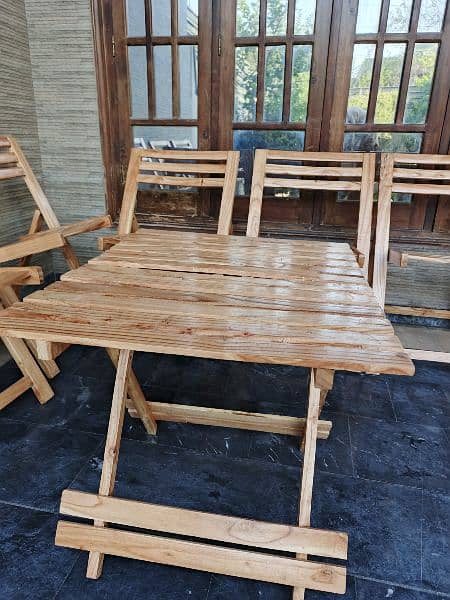 Six foldable wooden chairs with table 2