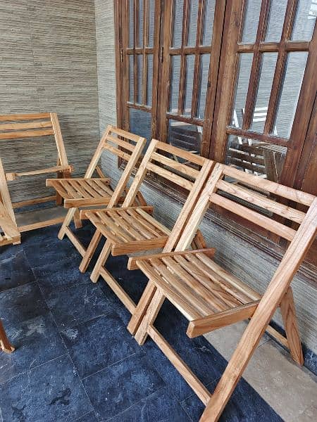 Six foldable wooden chairs with table 3