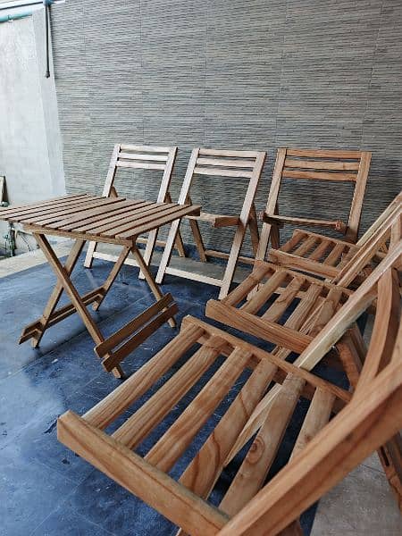 Six foldable wooden chairs with table 4