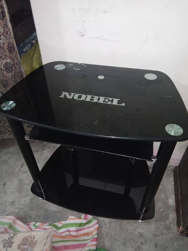 T. V and dinning table glass and steel Nobel 1