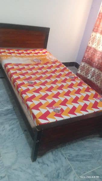 wooden bed  with mettres. 1