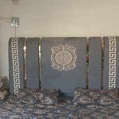 king size bed with poshish side table and spring mattress