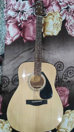 Yamaha f310 guitar, with original box and bag.