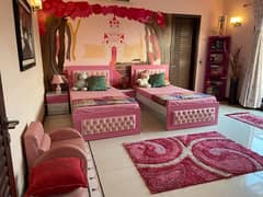 Handmade, pink bedroom set made with wood and leather.