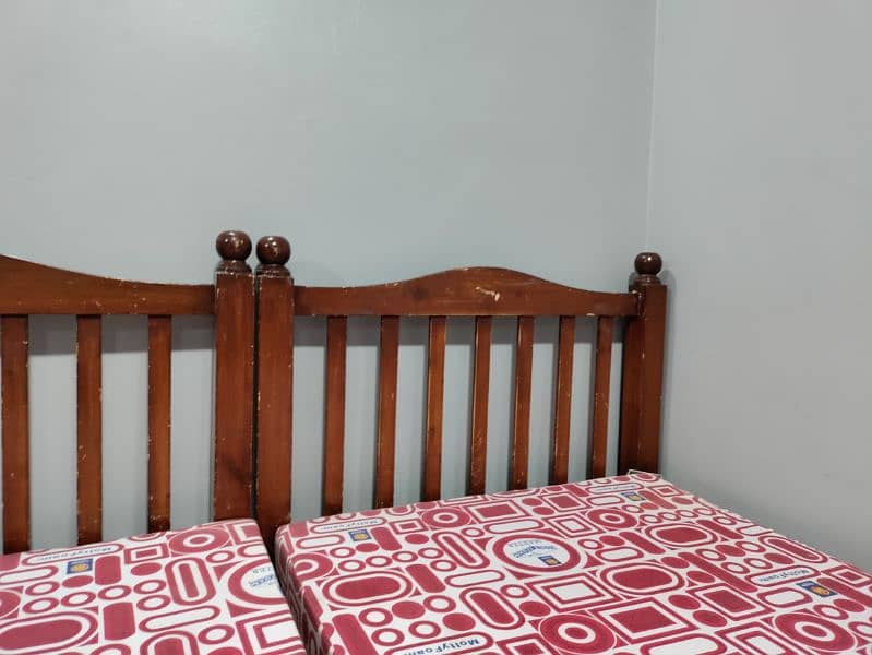 wooden 2 single bed with mattress 9