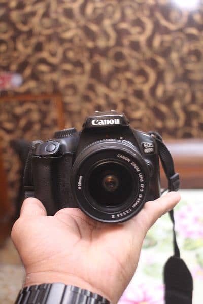 Canon 4000d with 18 55mm lens / WiFi model. 7