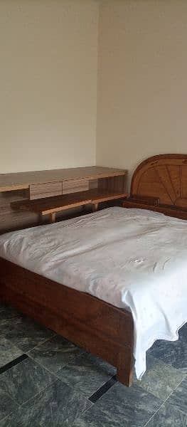 wooden double bed 0