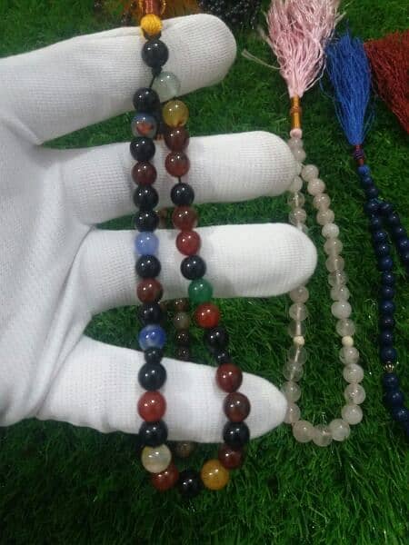 MULTIPLE NATURAL TASBEEH COLLECTION WITH NICE SAPPHIRE AND RUBY RINGS. 2