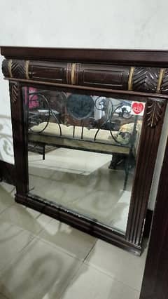 A large mirror with premium wood