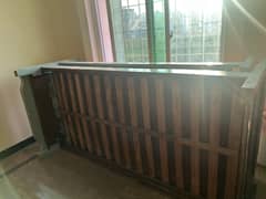 Two single beds with good wood frame for 10000