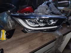 toyota yaris hybrid R. H head light back bumper 0