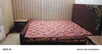 bed with mattress with to side table