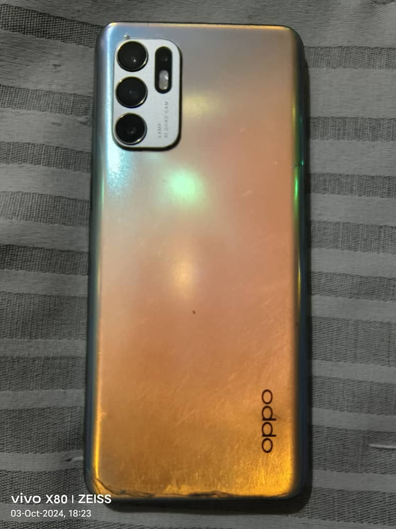 OPPO RENO 6.  RAM 8GB+8GB.  ROM 128GB 2