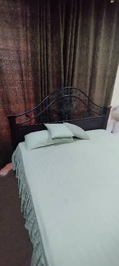 Bed with wall mirror and spring mattress