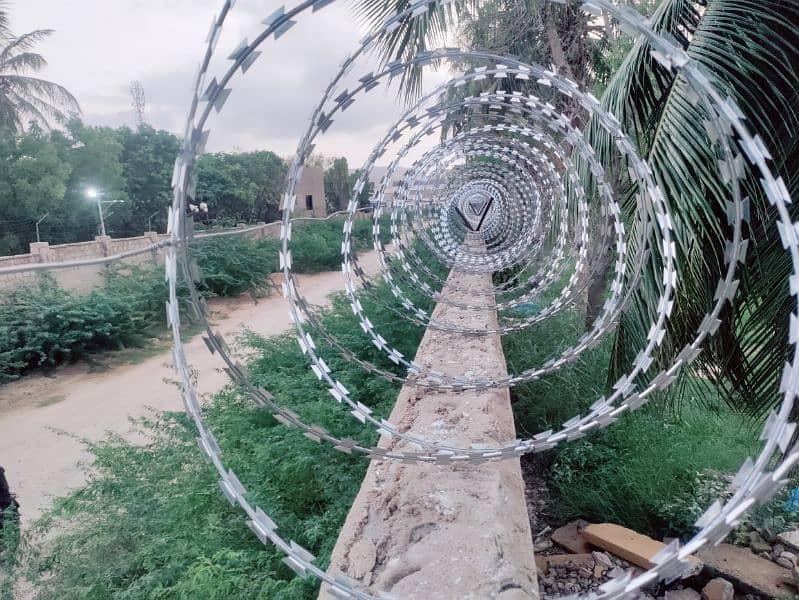 BOUNDARY WALL SECURITY RAZOR WIRE AND ELECTRIC FENCE AVAILABLE 6