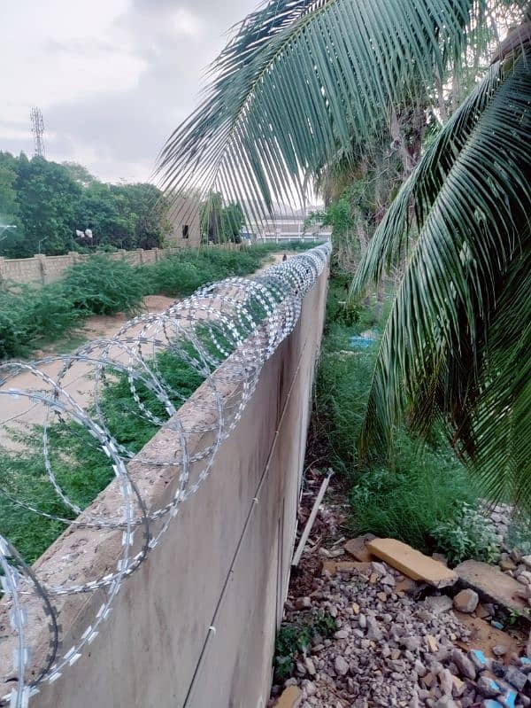 BOUNDARY WALL SECURITY RAZOR WIRE AND ELECTRIC FENCE AVAILABLE 7