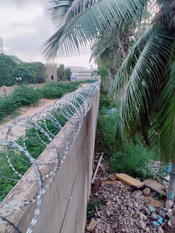 BOUNDARY WALL SECURITY RAZOR WIRE AND ELECTRIC FENCE AVAILABLE 8