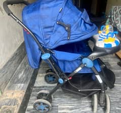 baby stroller pram. in neat and clean condition . with musical  doll