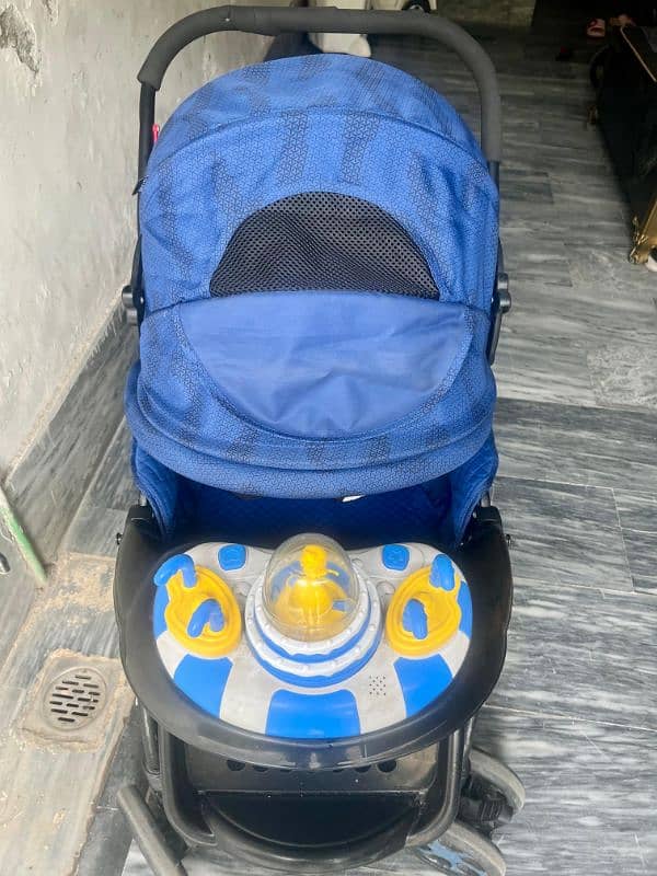 baby stroller pram. in neat and clean condition . with musical  doll 6