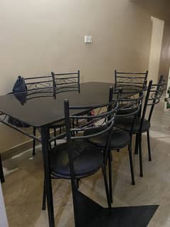 Rod iron dining table with 6 chairs - glass top 0