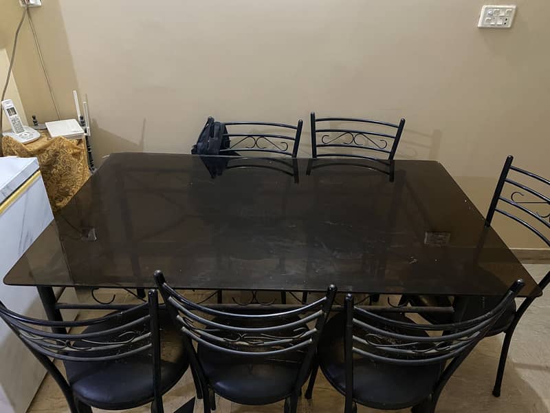 Rod iron dining table with 6 chairs - glass top 1