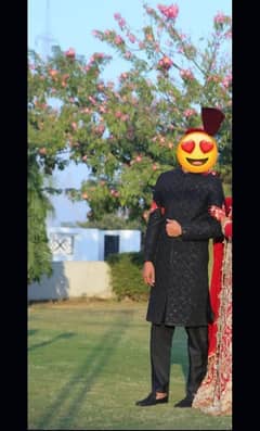 Groom black sherwani with hand work