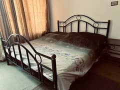 Wrought Iron King Size Bed with Side tables.