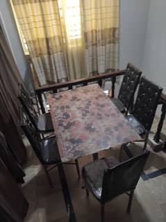 Dining table with printed top glass and 5 chairs