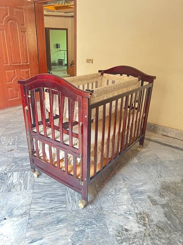 wooden baby cot with swing and a study table 1