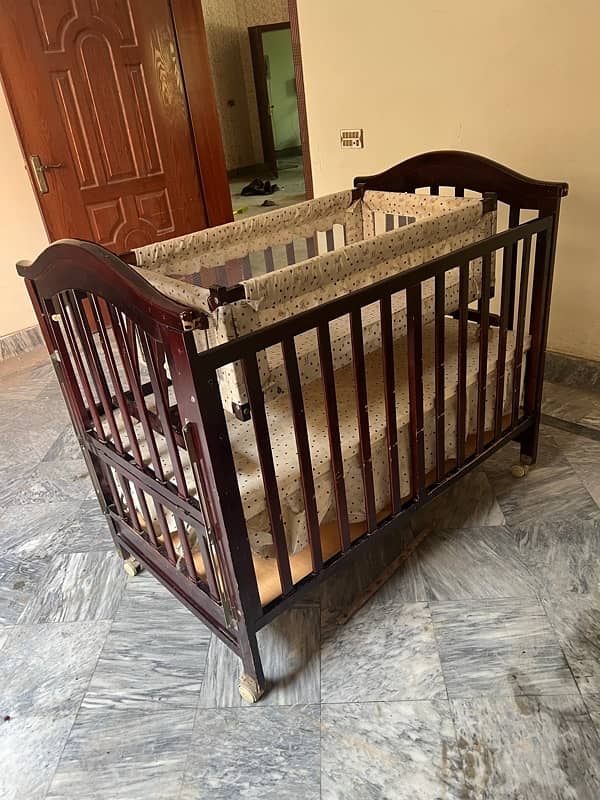 wooden baby cot with swing and a study table 2