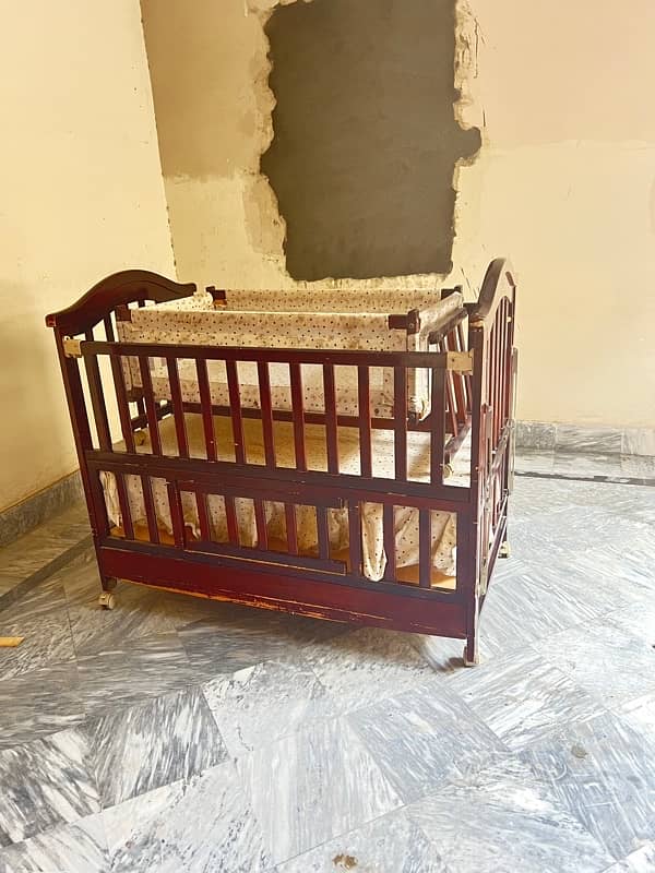 wooden baby cot with swing and a study table 3