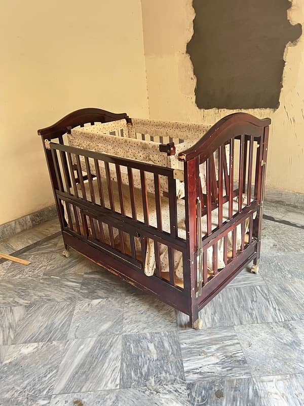 wooden baby cot with swing and a study table 4