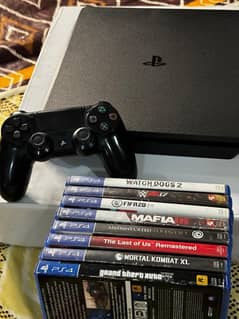 PS4 Slim with 2 controllers with 8 original games